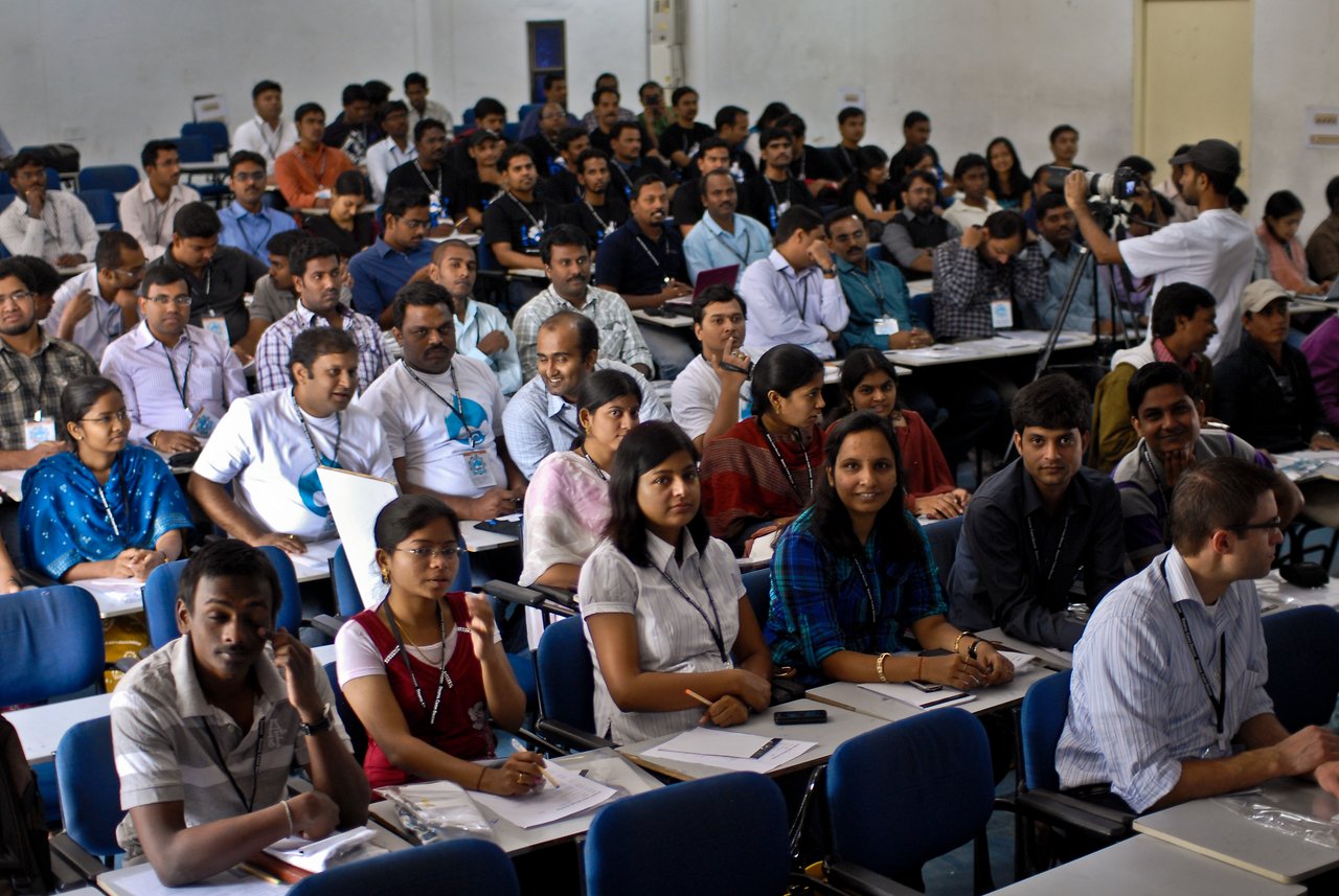 Drupalcamp Deccan attendees A large group of attendees sits in a conference room, listening and taking notes at Drupalcamp Deccan.