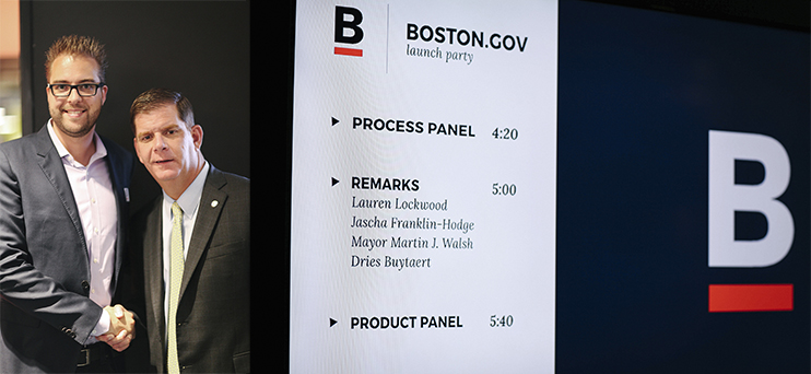 Boston gov launch event Two people pose at the Boston.